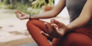 Young woman meditating outdoors