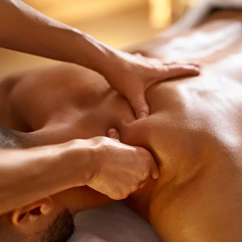 Man being massaged by massage therapist